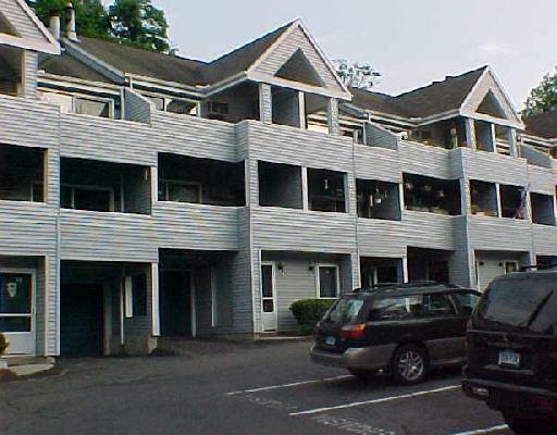 a view of a car park in front of house