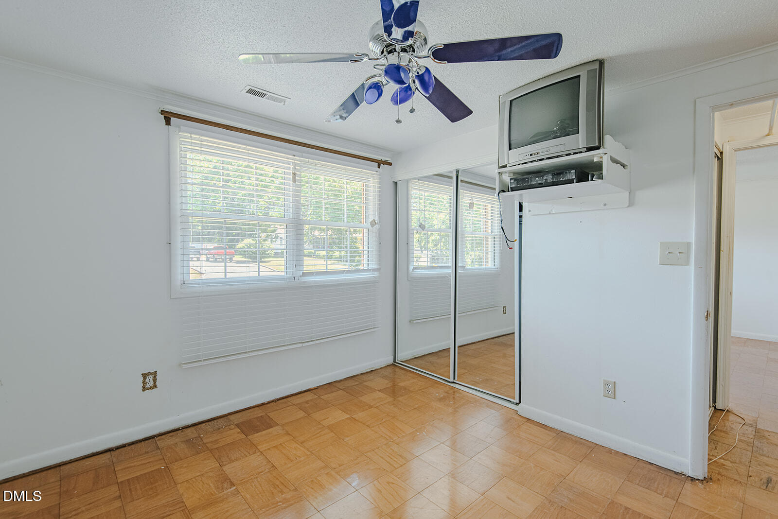 1302 Blacksmith Road Efland, NC 27243 - Photo 25 of 46 a view of a livingroom with a ceiling fan window and a flat screen tv