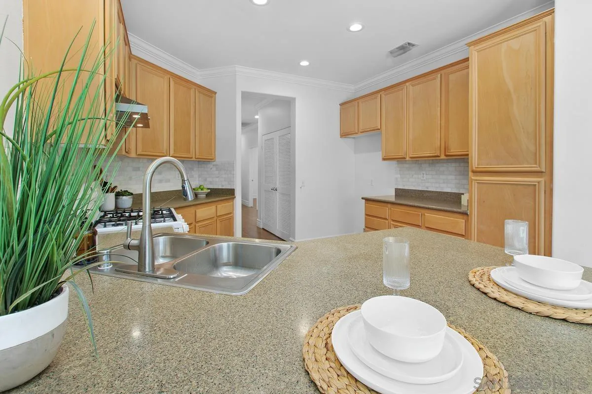 1132 Tabernacle Lane San Jacinto, CA 92582 - Photo 11 of 39 a kitchen with a sink a stove and a refrigerator