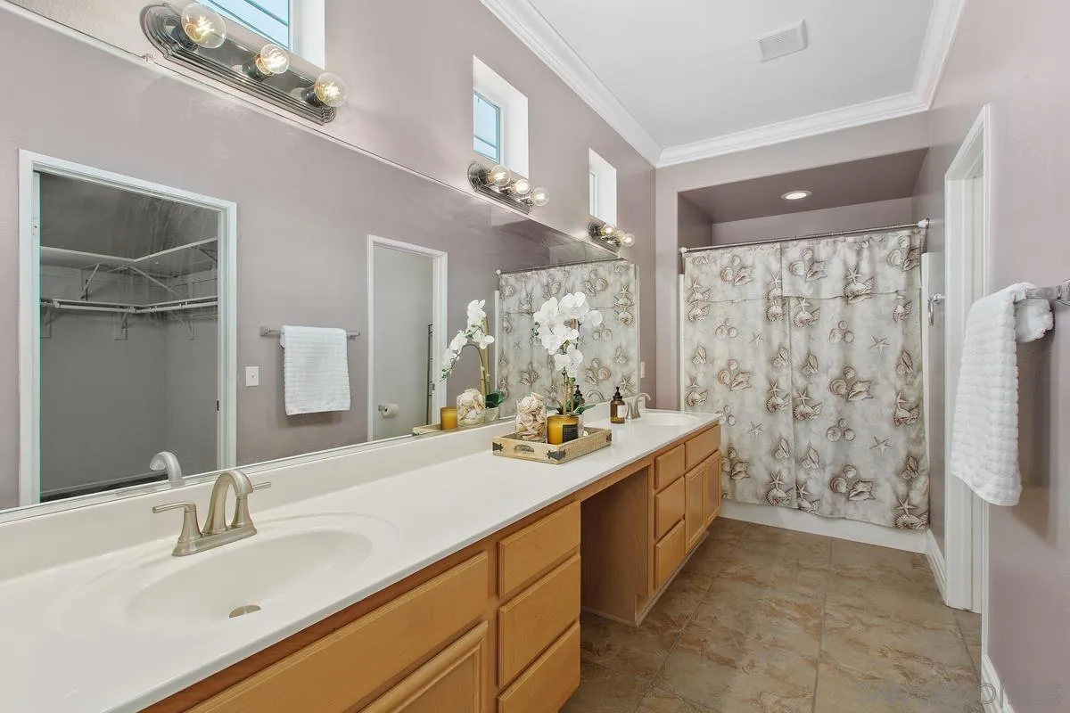 1132 Tabernacle Lane San Jacinto, CA 92582 - Photo 15 of 39 a spacious bathroom with a double vanity sink mirror and shower