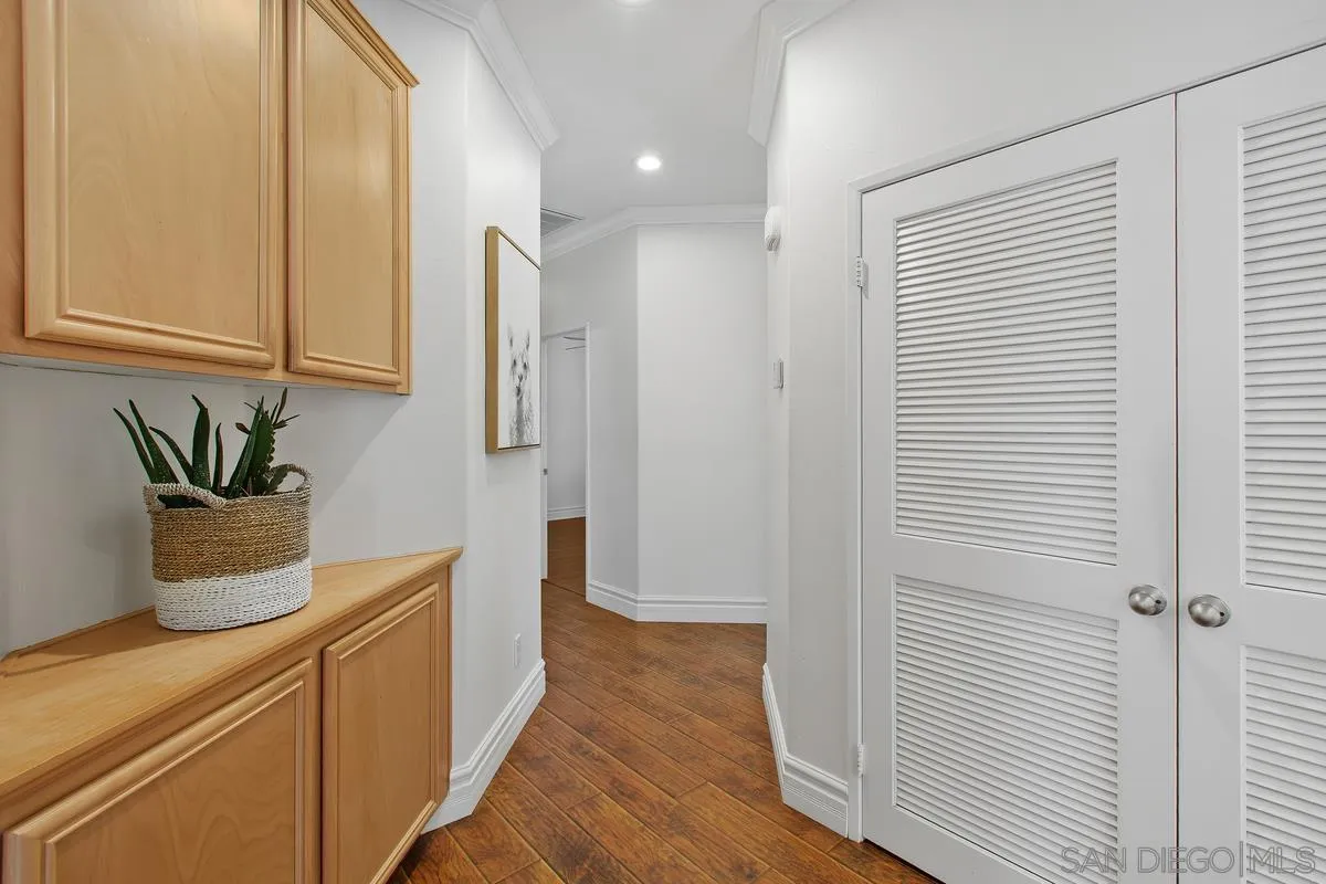 1132 Tabernacle Lane San Jacinto, CA 92582 - Photo 20 of 39 a hallway with sink and wooden floor