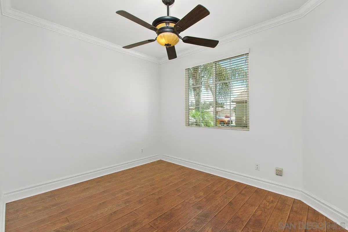 1132 Tabernacle Lane San Jacinto, CA 92582 - Photo 22 of 39 an empty room with a window and a fan