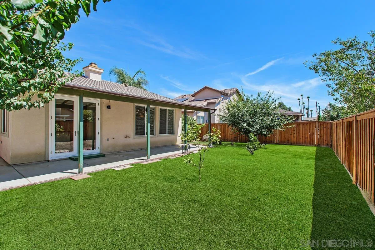 1132 Tabernacle Lane San Jacinto, CA 92582 - Photo 27 of 39 a view of a house with a yard and a garden