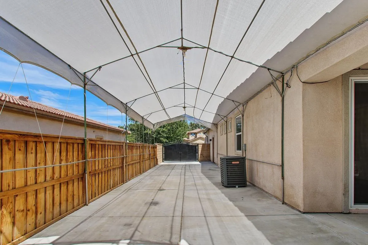 1132 Tabernacle Lane San Jacinto, CA 92582 - Photo 32 of 39 a view of a porch with wooden floor and iron stairs