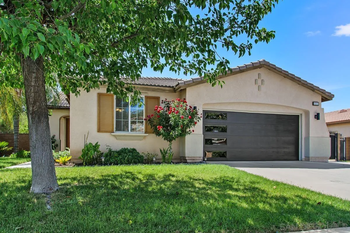 1132 Tabernacle Lane San Jacinto, CA 92582 - Photo 37 of 39 a front view of a house with a yard and garage