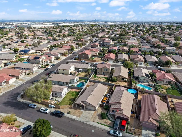 an aerial view of a house with a garden space