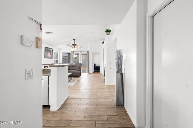 a view of a living room with windows