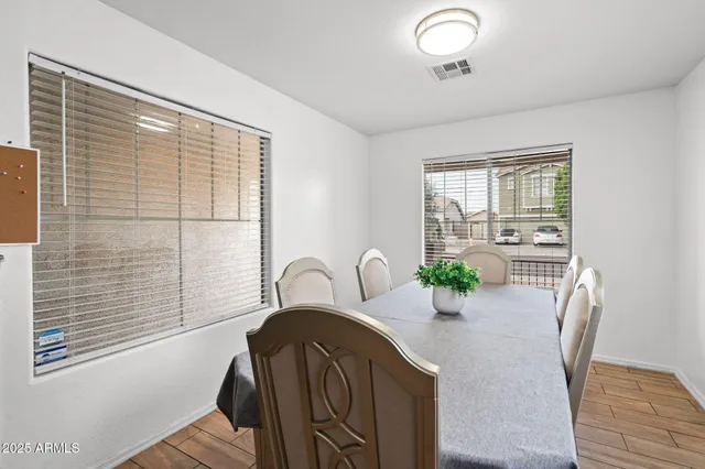 a dining room with furniture and window