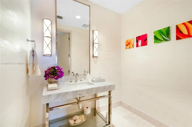 a bathroom with a sink vanity and a mirror