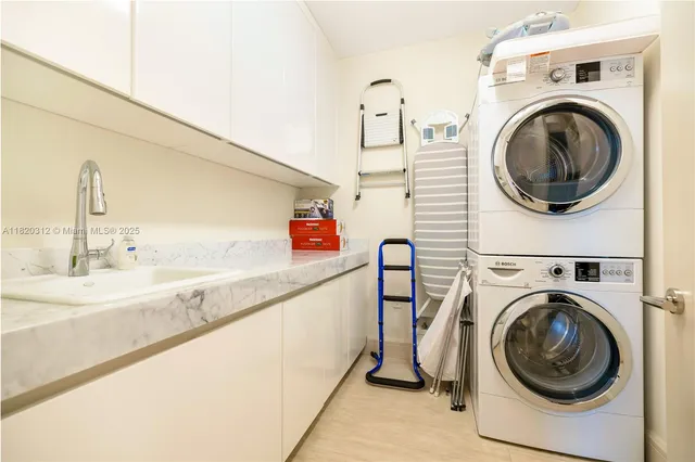 a view of a hallway with washer and dryer