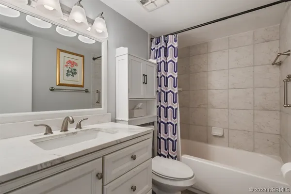 a bathroom with a sink a toilet and a bathtub