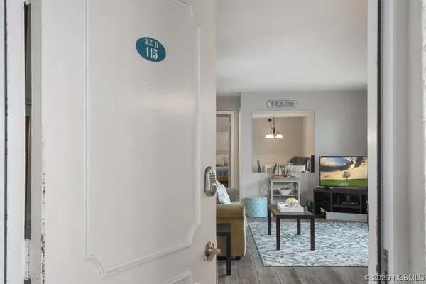 a view of a livingroom with furniture and lounge chair
