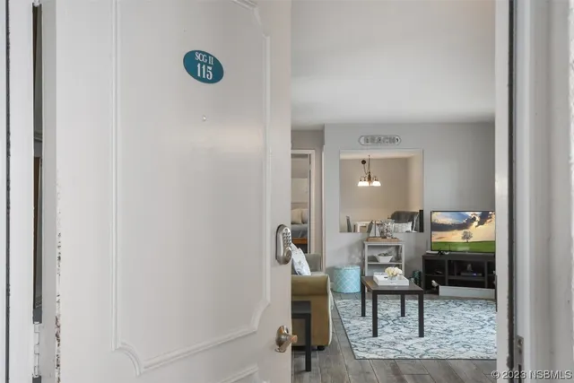 a view of a livingroom with furniture and lounge chair