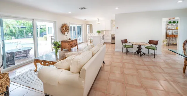 a living room with furniture and a table