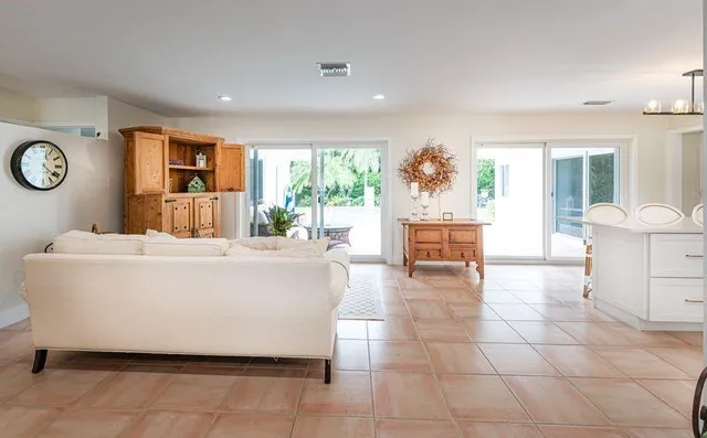 a living room with a couch and a large window