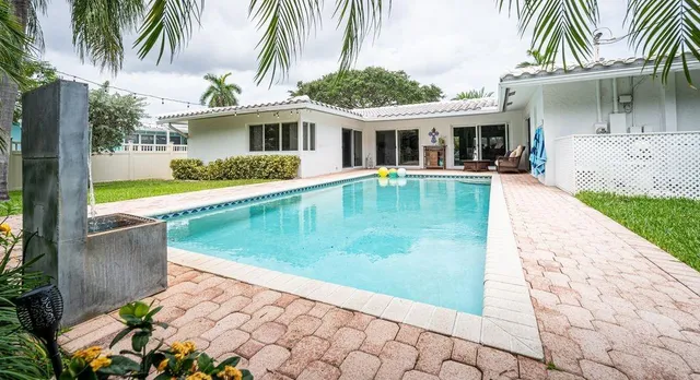 a view of a house with a swimming pool