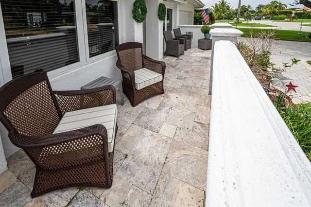 a view of swimming pool with outdoor seating and yard in the back