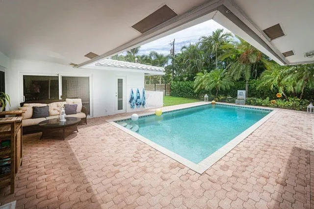 a view of a patio with a backyard