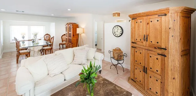 a view of living room filled with furniture and wooden floor