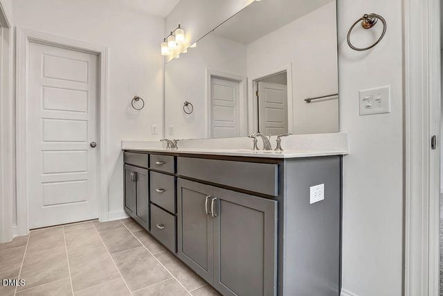 a kitchen with a sink and a refrigerator