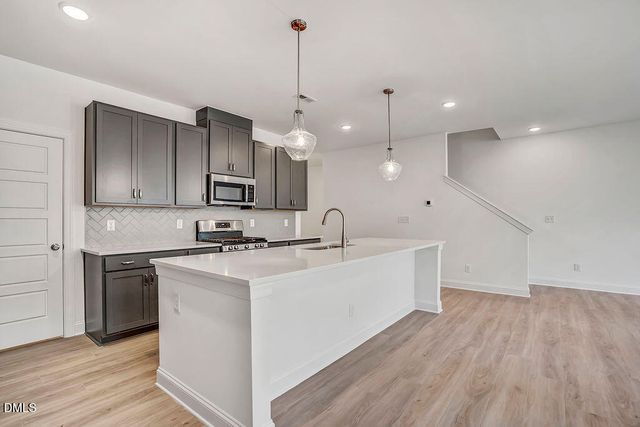a view of a kitchen with electric appliances