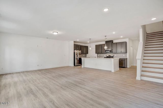 a view of kitchen with granite countertop a stove top oven
