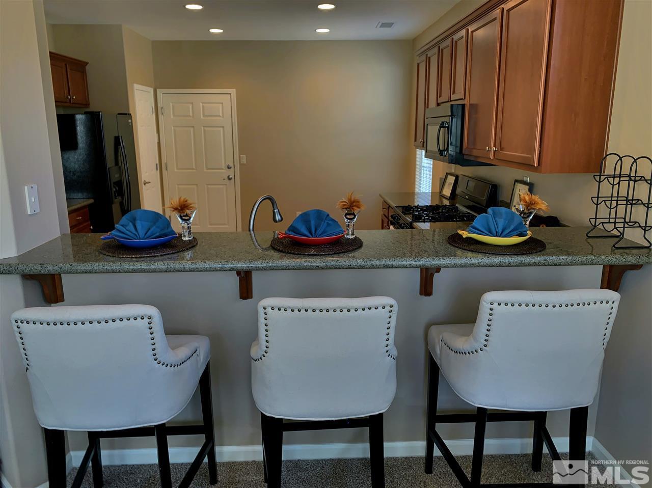 11052 Lamour Lane Reno, NV 89521 - Photo 8 of 23 a kitchen with a table and chairs in it