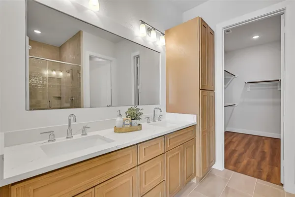 a bathroom with a double vanity sink mirror and double