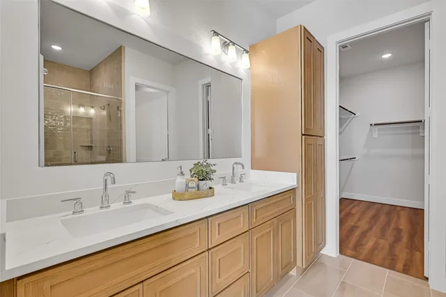 a bathroom with a double vanity sink mirror and double