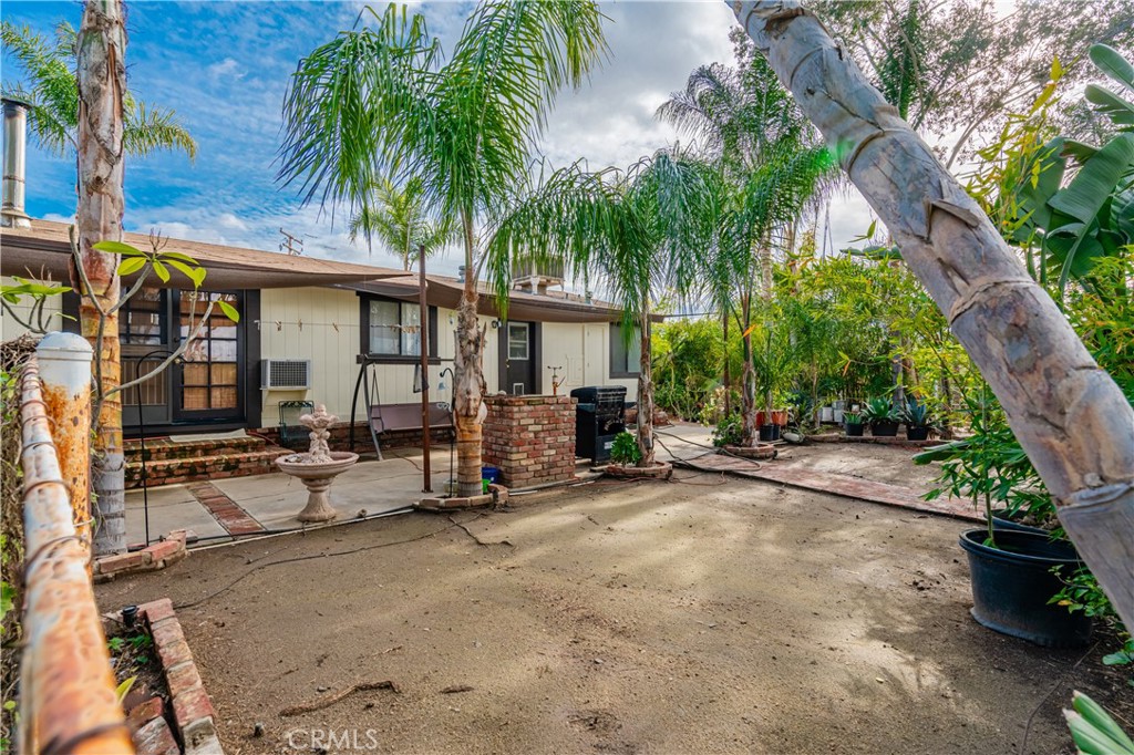 20950 Claire Road Perris, CA 92570 - Photo 15 of 74 a view of a house with backyard and sitting area