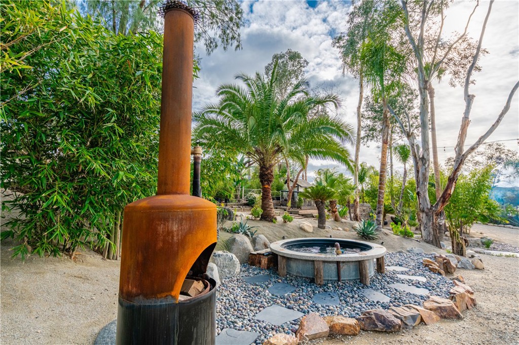 20950 Claire Road Perris, CA 92570 - Photo 21 of 74 a view of a backyard with plants and outdoor seating