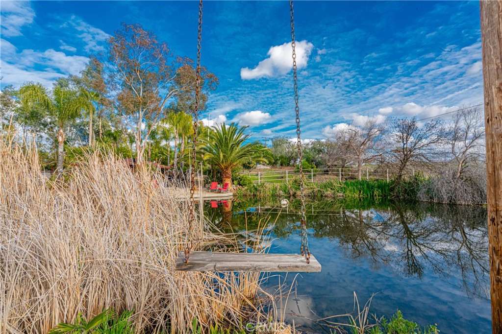 20950 Claire Road Perris, CA 92570 - Photo 30 of 74 a balcony with table and chairs and potted plants