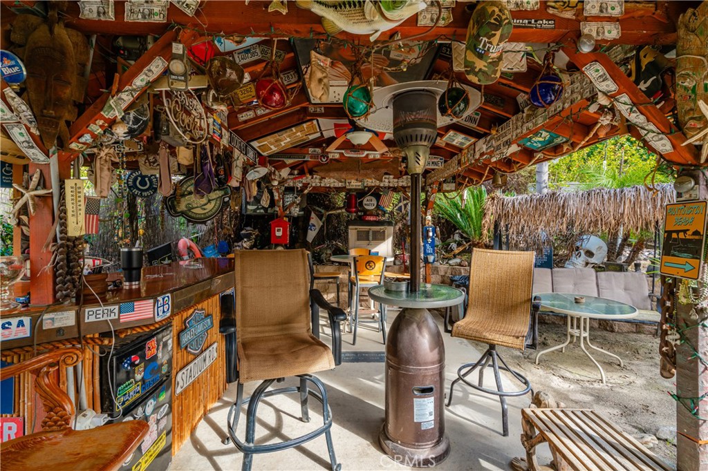 20950 Claire Road Perris, CA 92570 - Photo 35 of 74 a view of a chairs and tables in patio