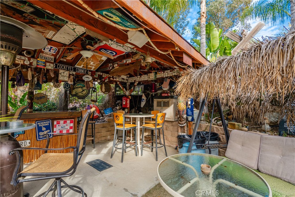 20950 Claire Road Perris, CA 92570 - Photo 36 of 74 a view of a chairs and tables in patio