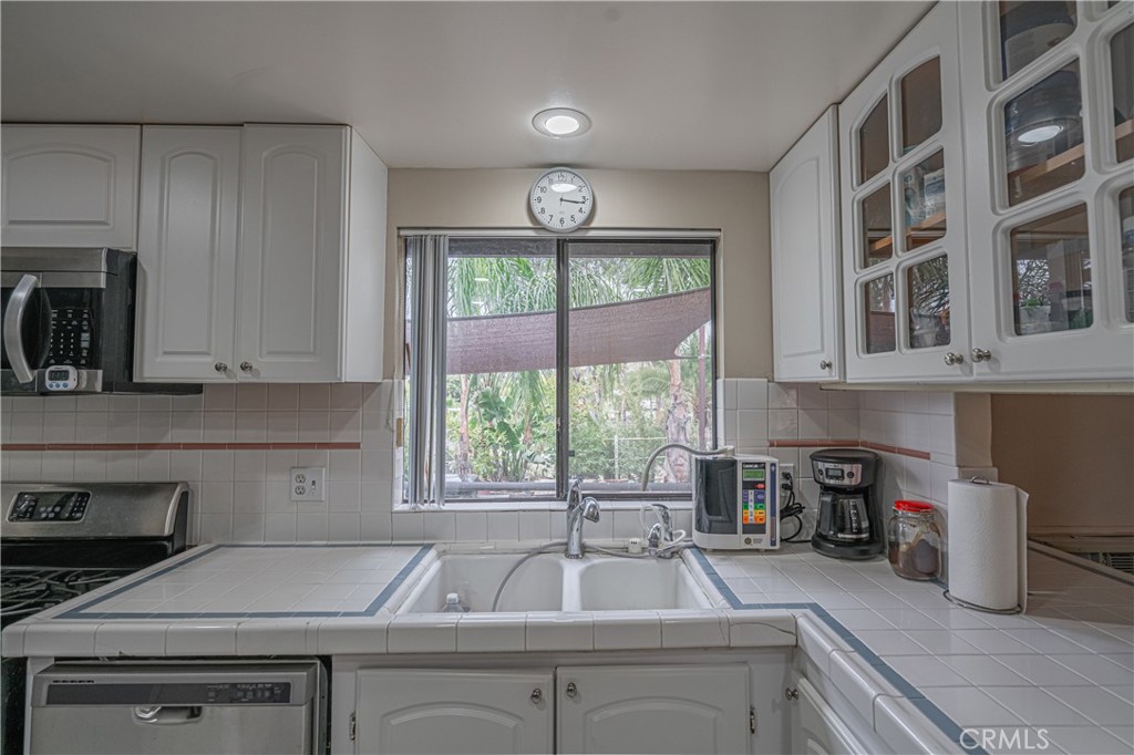 20950 Claire Road Perris, CA 92570 - Photo 45 of 74 a kitchen that has a sink and a stove