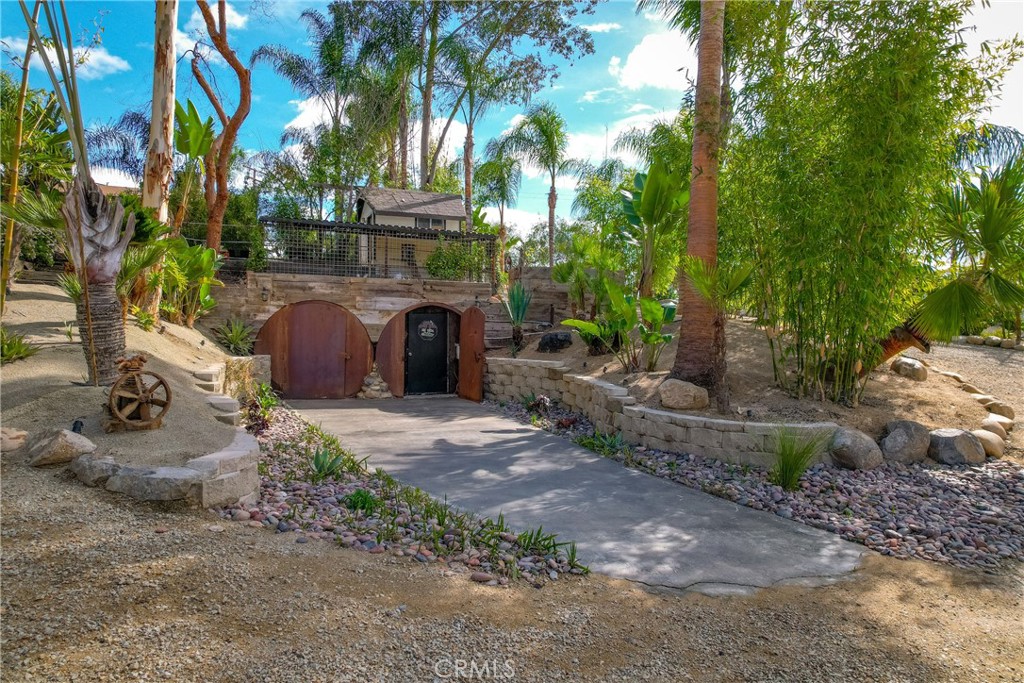 20950 Claire Road Perris, CA 92570 - Photo 60 of 74 a view of a street with potted plants and large trees