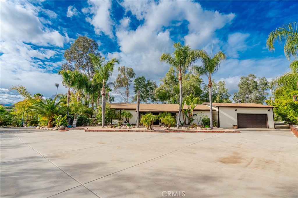 20950 Claire Road Perris, CA 92570 - Photo 6 of 74 a house with palm trees in the background