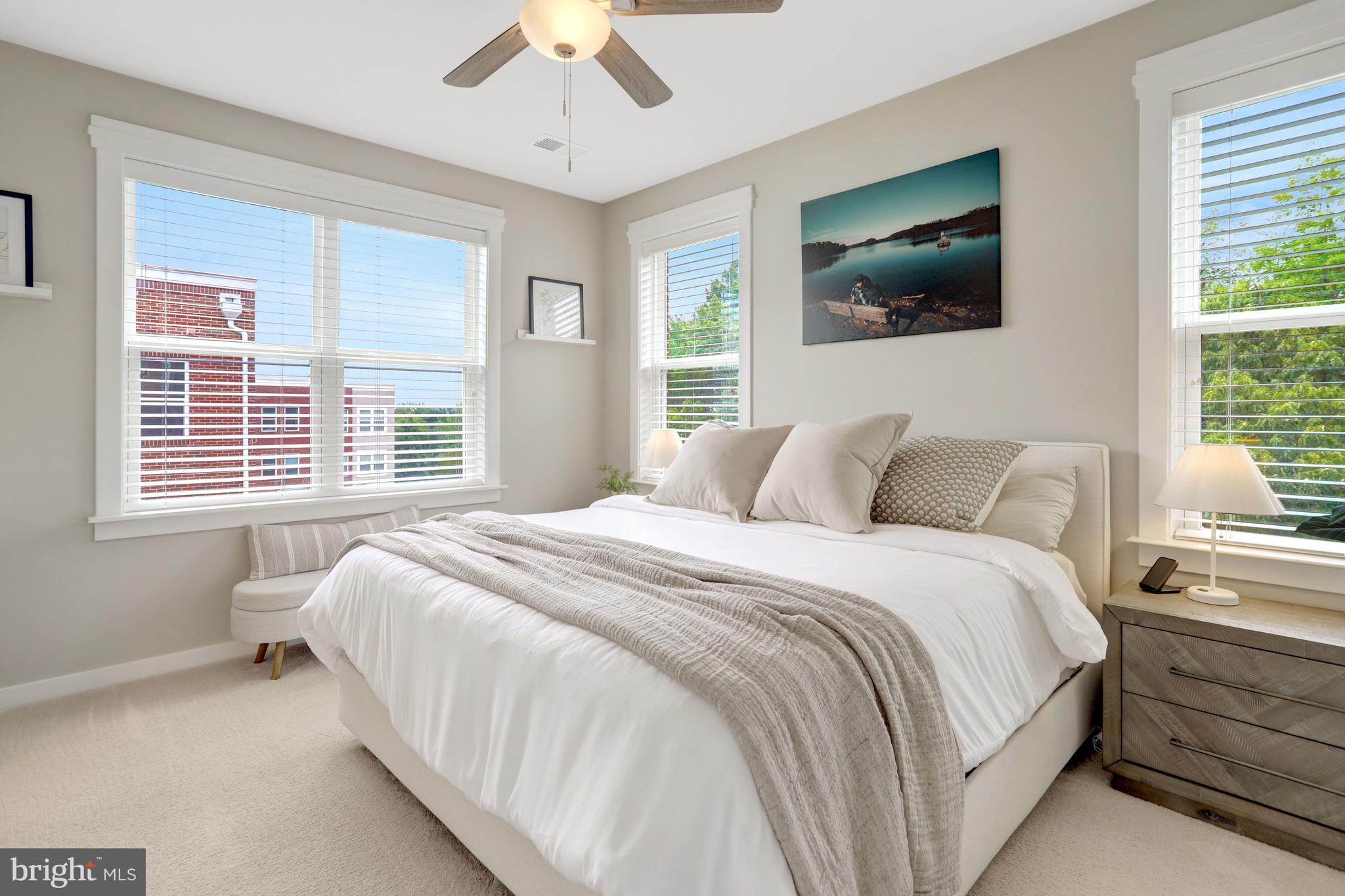 9180 Snowden Ashford Road Lorton, VA 22079 - Photo 20 of 28 a bedroom with a large bed and a flat screen tv