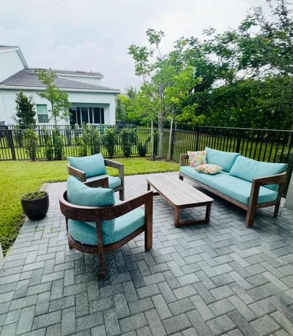 a patio with patio couch and outdoor view