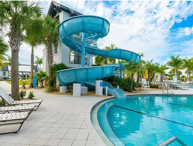 a view of a swimming pool with a patio