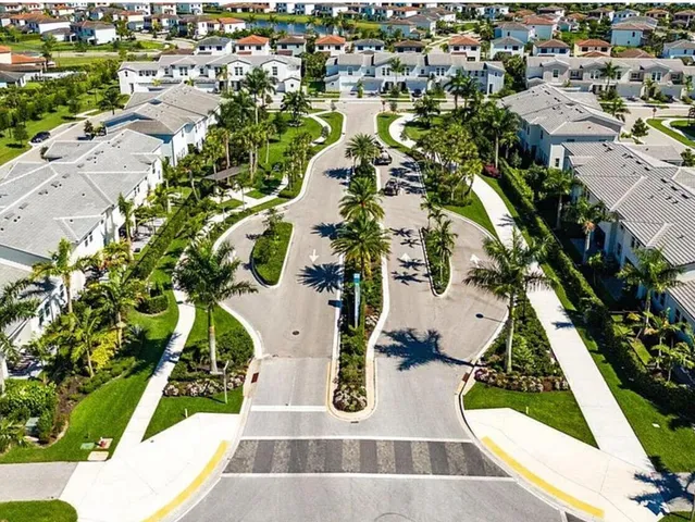 an aerial view of residential houses with outdoor space