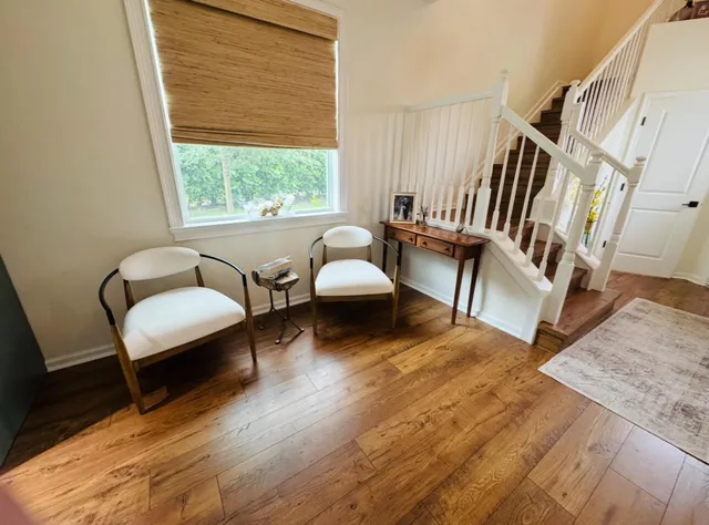 a living room with furniture and a window