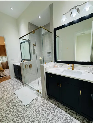 a bathroom with a sink double vanity and a mirror