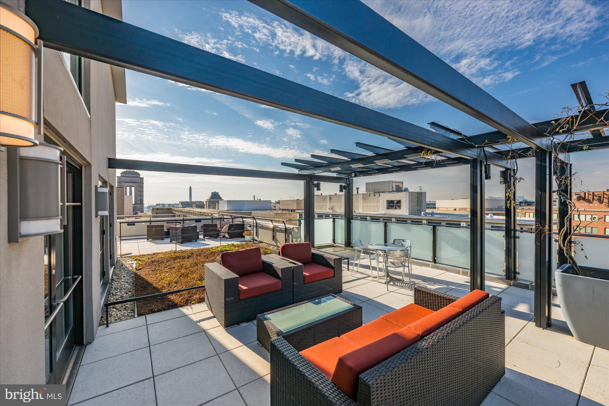 1133 14th Street Northwest, Unit 404 Washington, DC 20005 - Photo 13 of 15 a outdoor space with patio lots of furniture and iron stairs