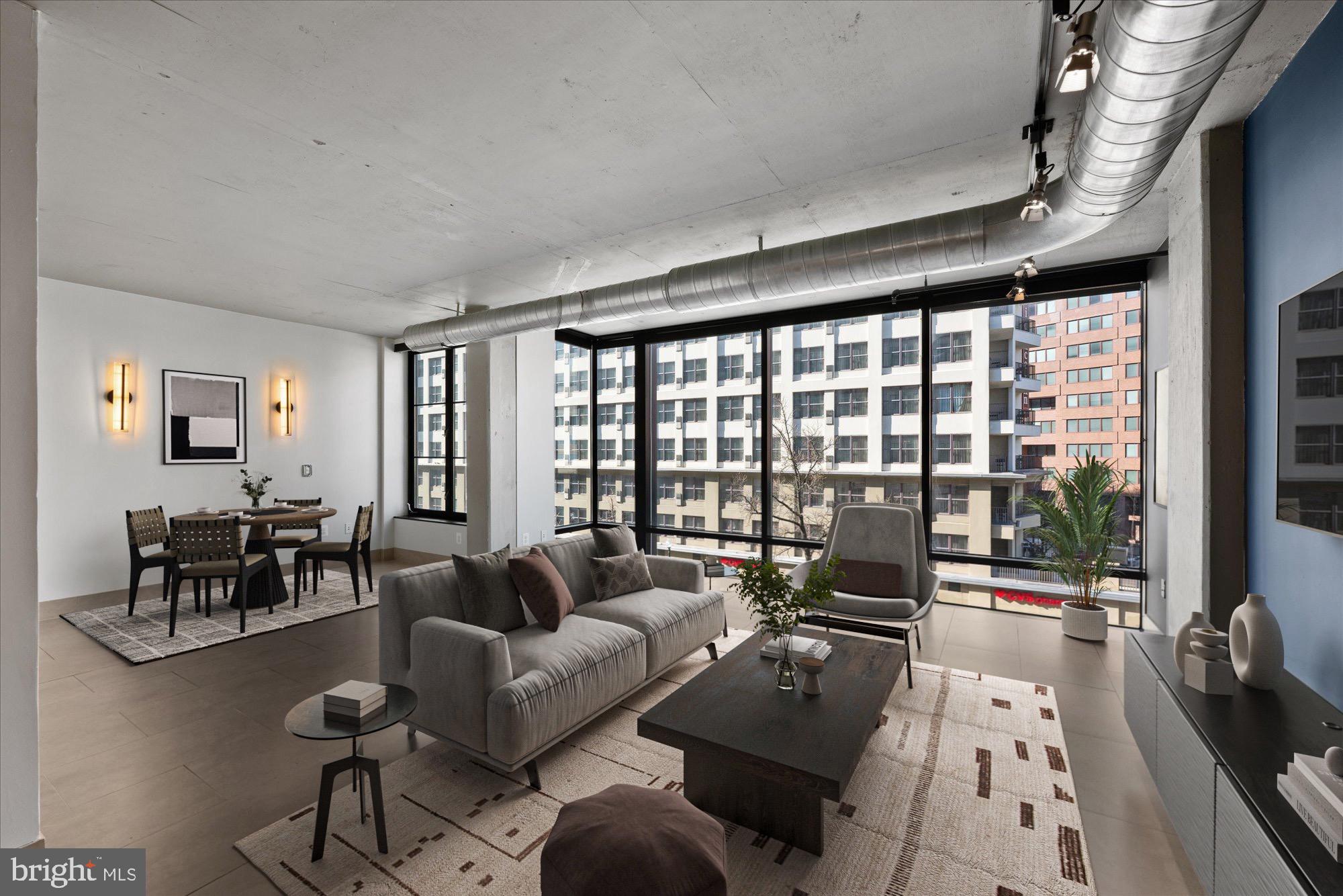 1133 14th Street Northwest, Unit 404 Washington, DC 20005 - Photo 3 of 15 a living room with furniture and a large window