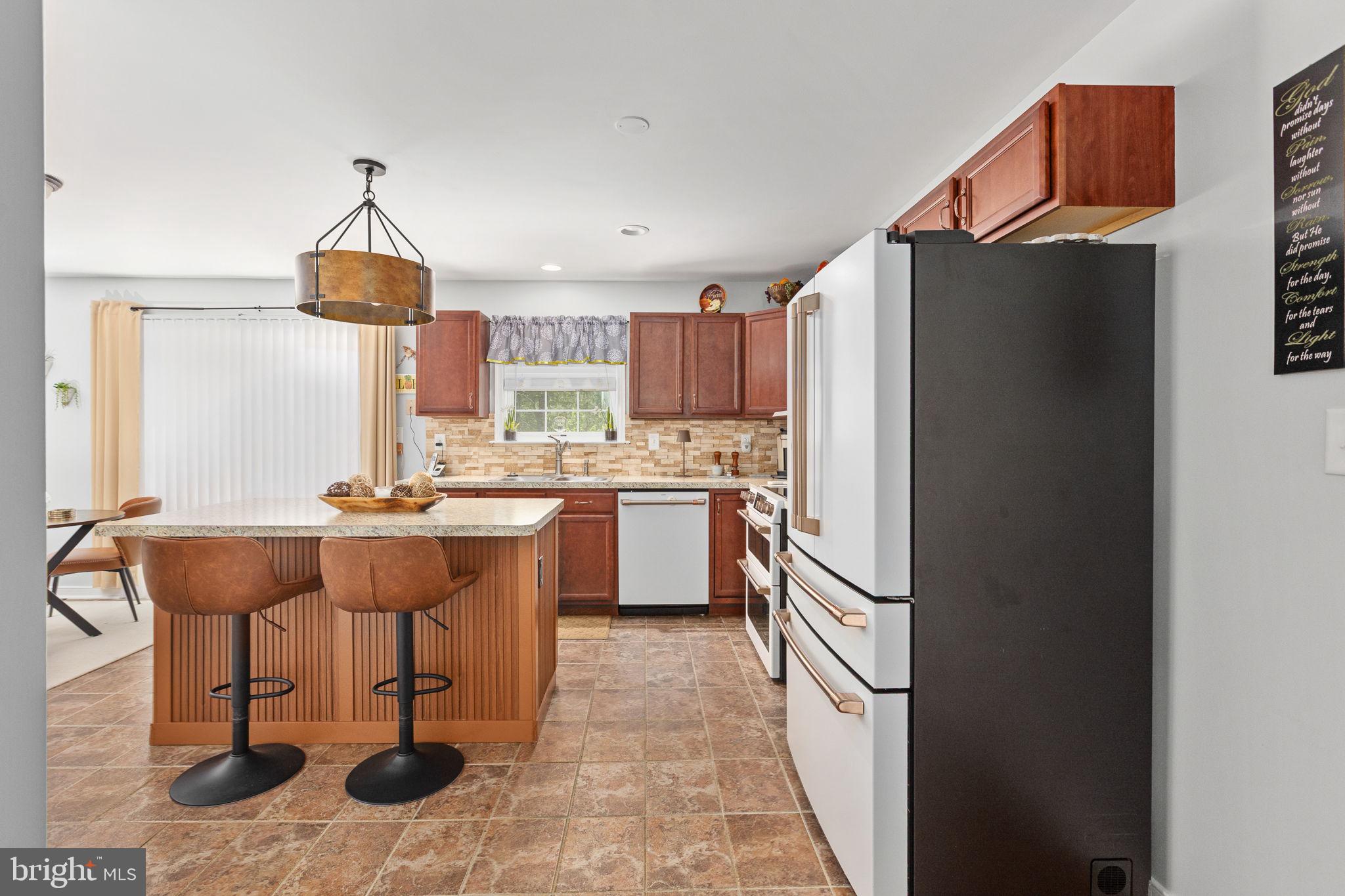 22088 Landora Bridge Road Ruther Glen, VA 22546 - Photo 42 of 122 Modern kitchen with warm tones.