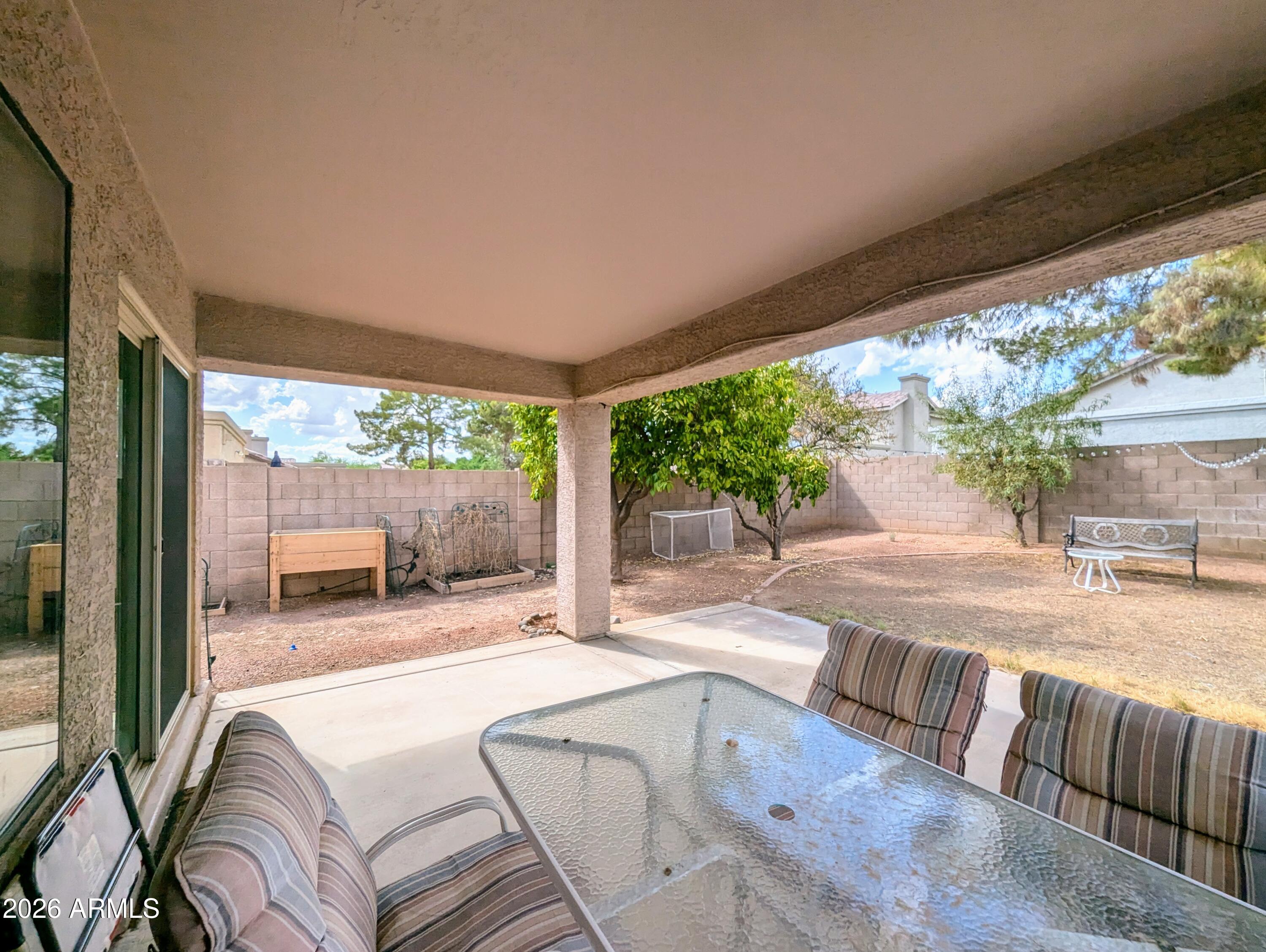 5424 West Wagoner Road Glendale, AZ 85308 - Photo 27 of 37 a spacious bedroom with a large window and a table