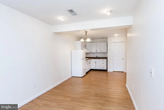 a view of kitchen with wooden floor