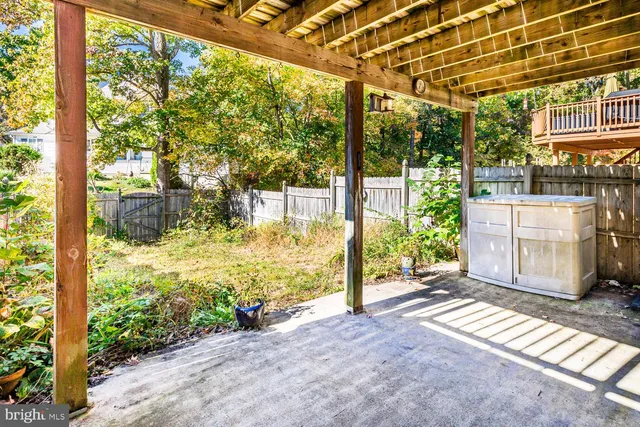 a view of a room with floor to ceiling windows and wooden floor
