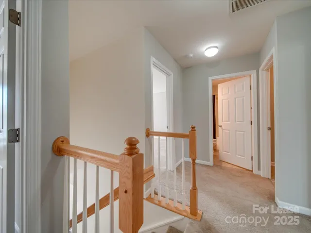 a view of a hallway with a door